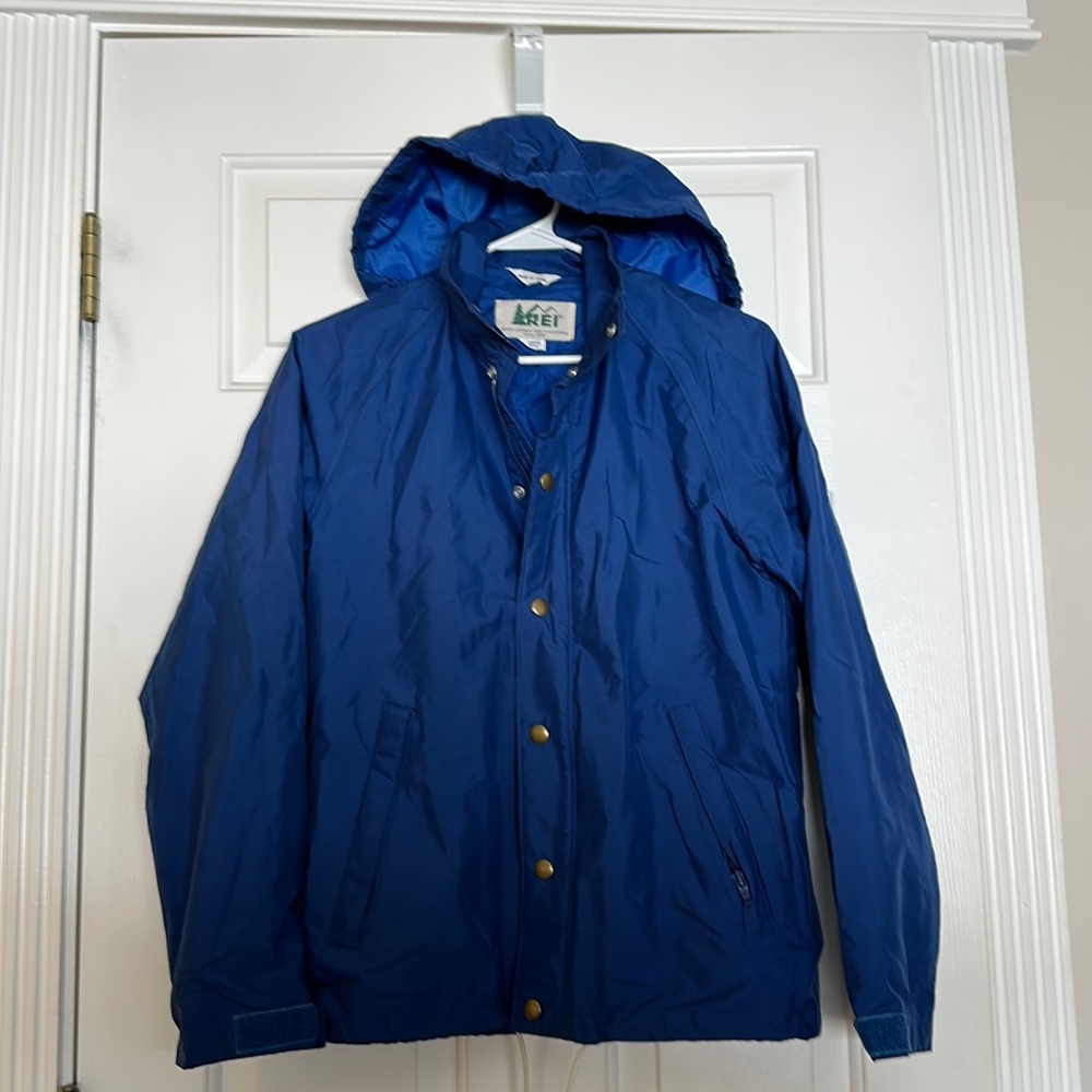 REI women’s small blue rain jacket